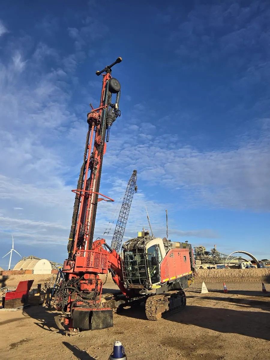 Rebuilt Sandvik Leopard surface drill with mast raised on a Western Australian mine site