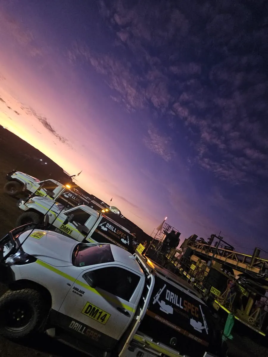 DM14 and the Drillspec fleet lined up under a purple dusk sky