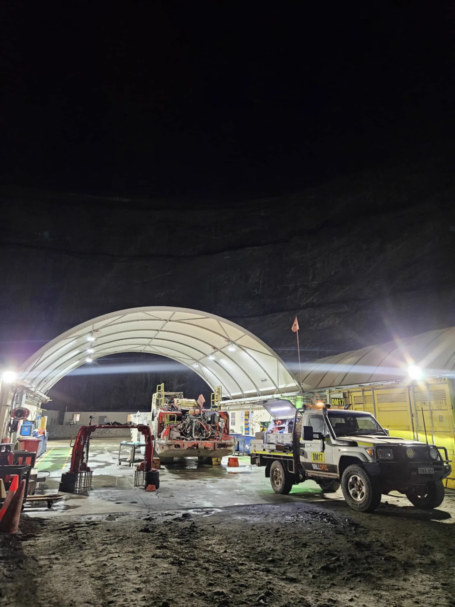 Drillspec DM17 service ute at a night-shift service dome with a drill rig in for repair