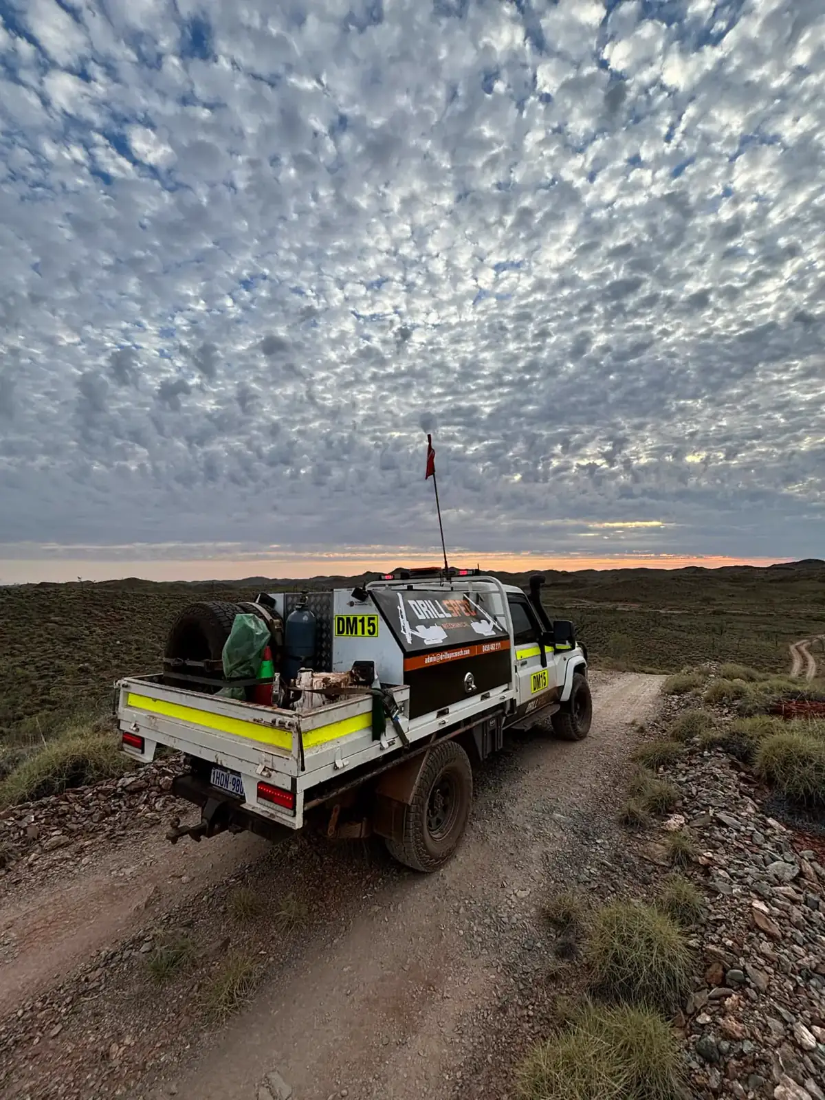 Drillspec DM15 service ute on a remote exploration track at dusk