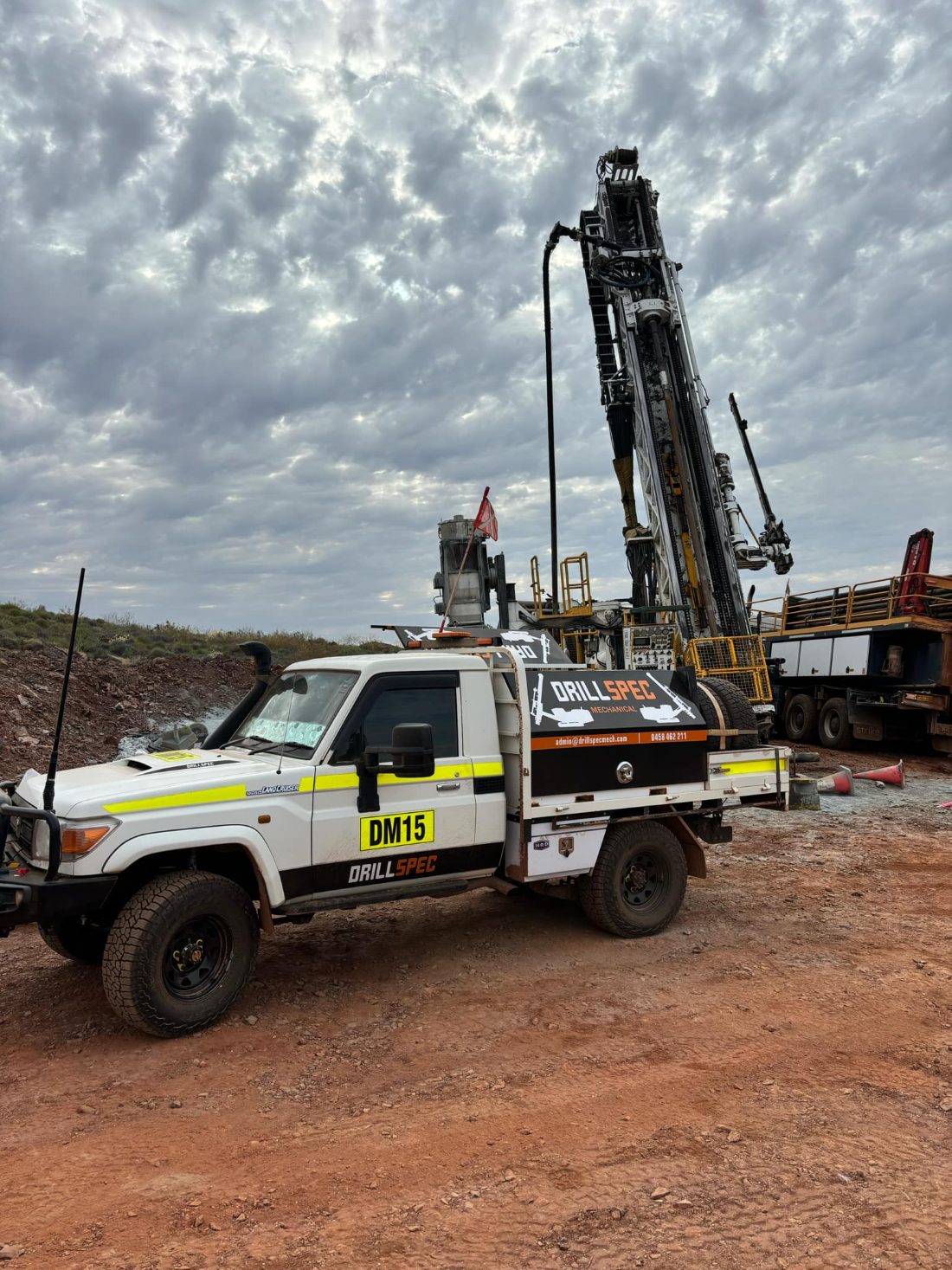 Drillspec exploration drill rig and service ute on site