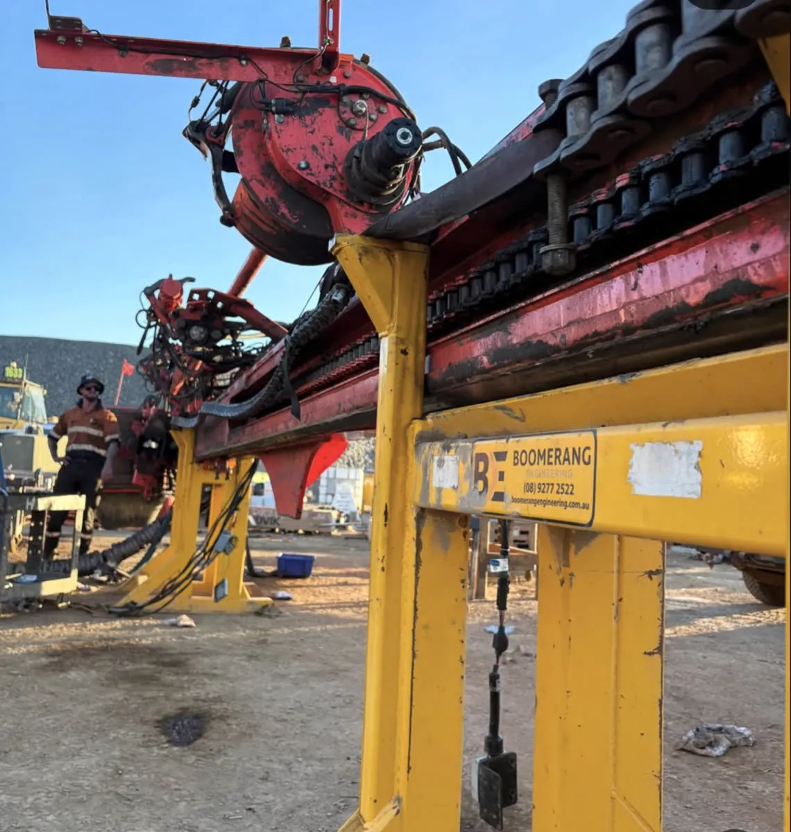 Leopard feed beam stripped for refurbishment on engineering stands, chains exposed