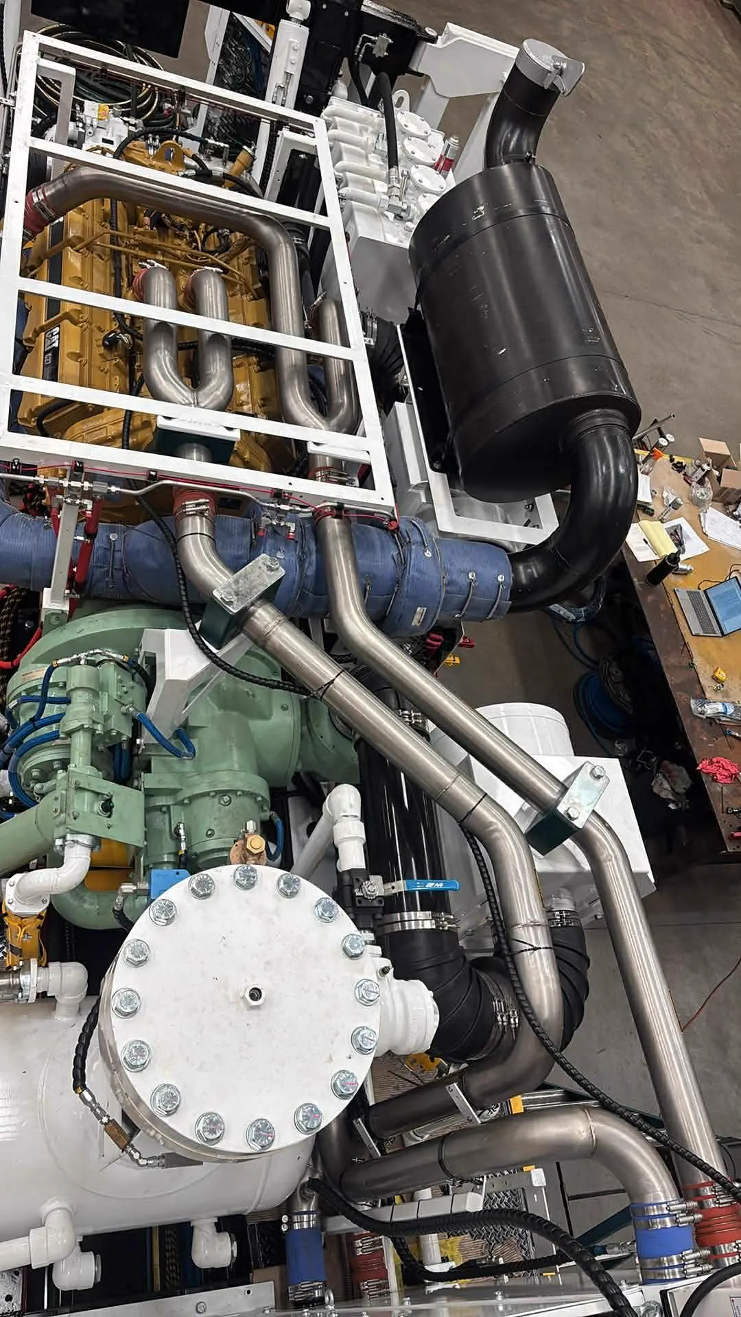 Rebuilt CAT power pack and compressor with fresh stainless exhaust pipework on the rig during the Perth rebuild